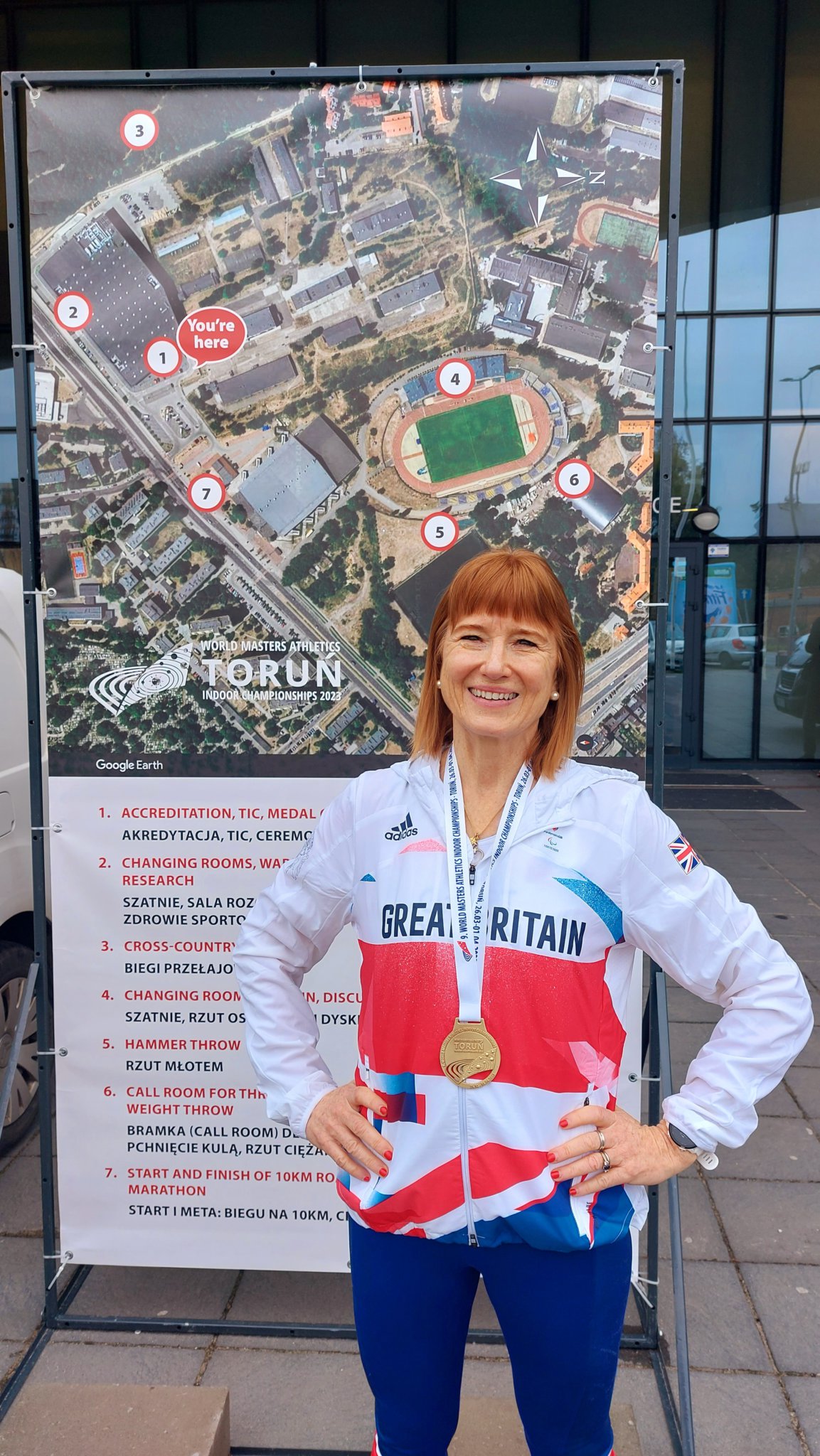 Susan Payne proudly wears the gold medal she won in Torun