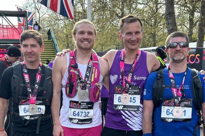 MP Jeremy Hunt is joined at the finish line of his second London Marathon in six months by friends of his brother Charlie's who were all raising money for Sarcoma UK