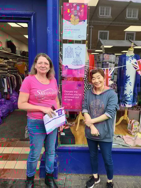 Macala Cooper, left, and Miyako Kamamoto outside the Alton Cancer Research UK shop, May 1st 2023.