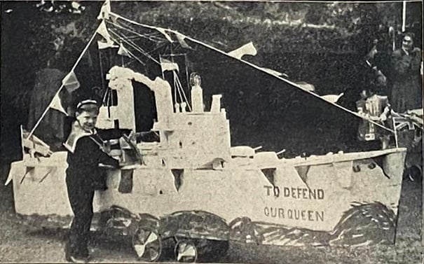 Six-year-old Kenneth Prior pushed the model of HMS Vanguard, made by his grandfather, in the 1953 Farnham Carnival procession – held as part of Farnham’s coronation celebrations