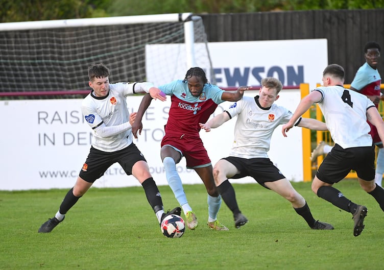 Shamal Edwards competes for possession during Farnham’s cup final win