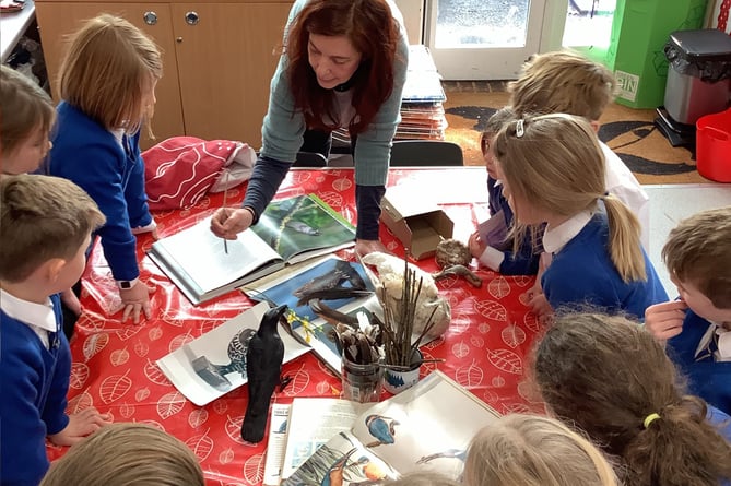 Red cube gallery curator Fi Scimone leads a St Mary’s Infant School art club session