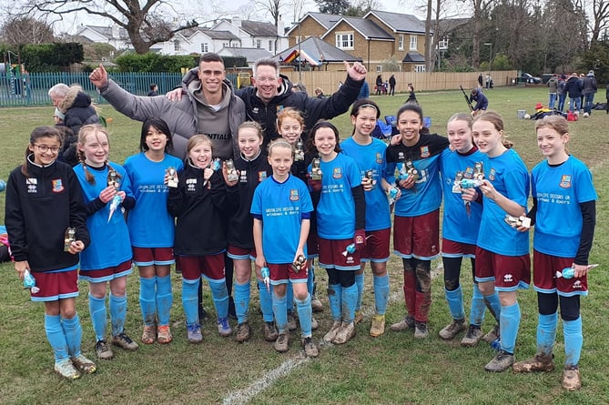 Farnham Town under-12 Lionesses celebrate after securing promotion