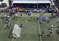 Alton food bank is the big winner at company’s football extravaganza