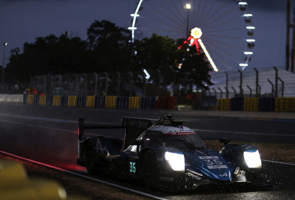 The Alpine car racing through the night at Le Mans