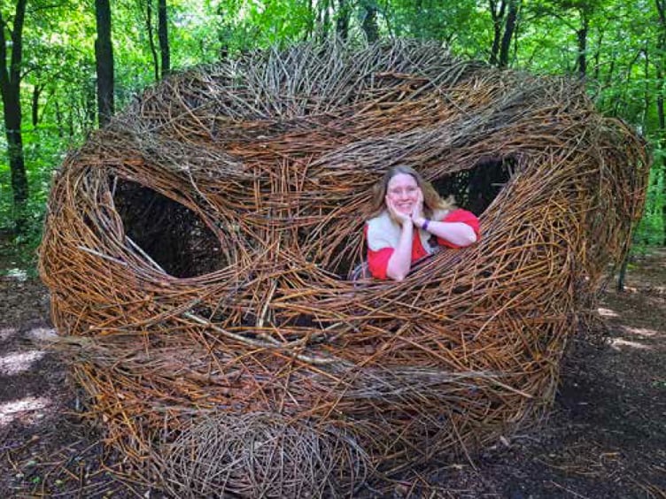Storyteller Dawn Nelson at the Giant’s Head sculpture in Queen Elizabeth Country Park, July 2023.