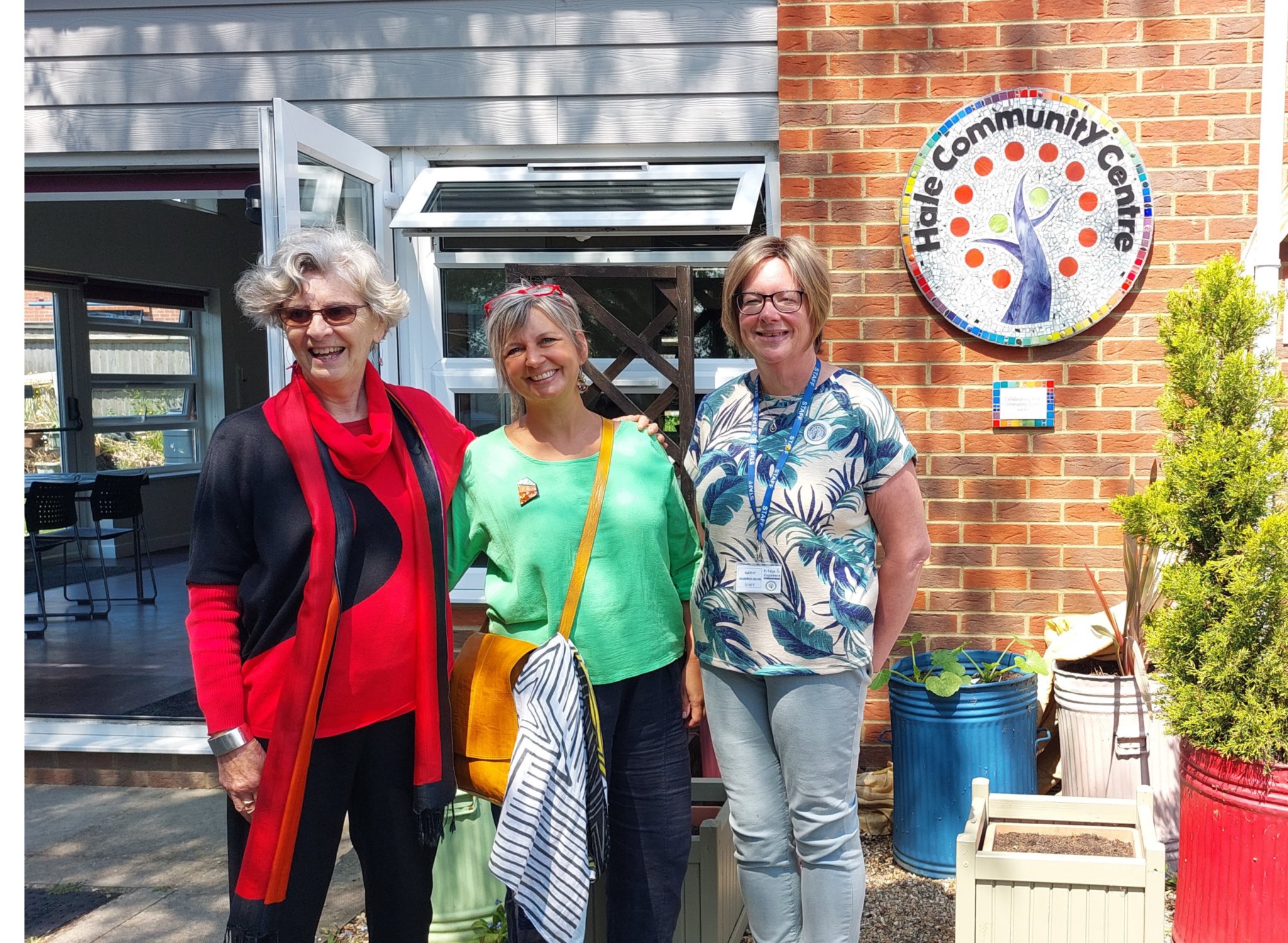 Norma Corkish, Denise Jacques and Cathy Burroughs unveil the mosaic