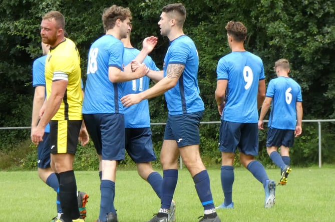 Liss Athletic celebrate one of their goals against Infinity