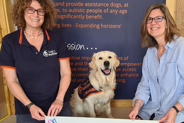 Laura McCreadie of Dogs For Autism receives a cheque from Kate Corbin of Styles and Associates, August 17th 2023.