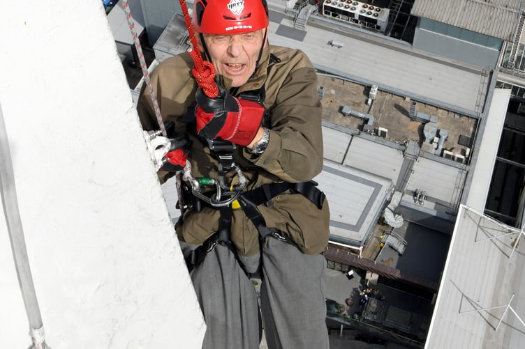 PETER WALKER SPINNAKER ABSEIL 
SPINNAKER TOWER, PORTSMOUTH, HAMPSHIRE
ENGLAND
AUGUST 2023
A 92-year-old Hampshire man undertook a charity abseil in memory of his journalist son who died in March of this year   
Hampshire's Peter Walker navigated his way down Portsmouthâs Spinnaker Tower accompanied by a professional abseiler to honour his son Jon who for many years had been the Chief Reporter at the Petersfield Post, Jon, who was 64, died just weeks after being diagnosed with terminal cancer
The Spinnaker Tower, known as 'The Sail of The Solent' is a 170 metre high observation overlooking the redevelopment of Portsmouth Harbour and the Gunwharf Quays retail complex below as well as offering a 'bird's eye view' of the adjoining Naval Base and across The Solent to the Isle of Wight 
During the summer months many people raise money for charities by experiencing the 100 metre descent and its associated adrenaline rush, but not many are 92 years of age ! 
Mr Walker Senior is aiming to raise money for Fitzroy, a charity often covered by his son which provides a range of services for adults with learning disability, autism and similar conditions.  Mr Walker, who is partially disabled and needed his doctorâs approval to undertake the challenge, said âMy son Jon was a legend because he loved Petersfield and its people and worked hard for them, for me, he is an inspiration....''I am self-sponsoring an abseil from the Spinnaker Tower to raise funds for, and to raise the profile of Fitzroy ''
Peter.....don't look down ! 
(Photo by Malcolm Wells)
 
Standard reproduction rates apply, contact Malcolm Wells to arrange payment - Mobile: 07802-217-569 
malcolmrichardwells@gmail.com