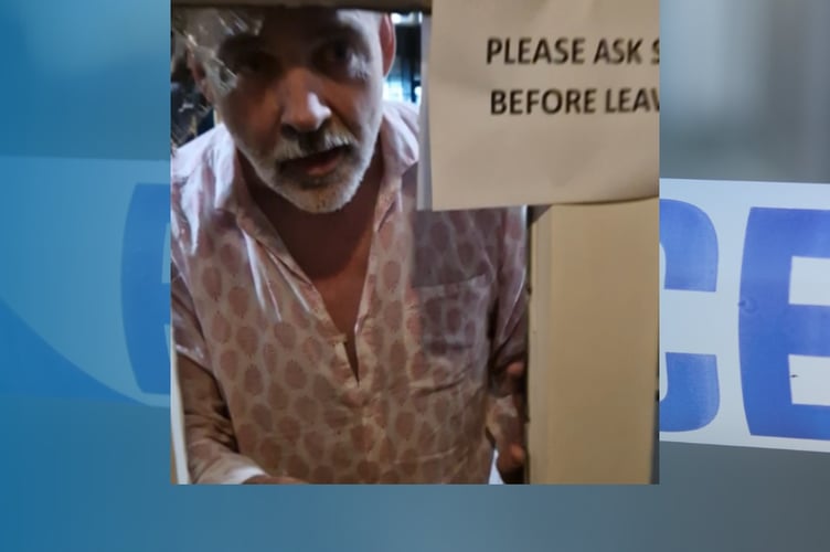 Police have released an image of a man they would like to speak to in connection with an act of criminal damage at The Queen's Head pub in Farnham
