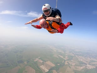 Ninety-year-old former Royal Navy commander raises £21,000 skydiving