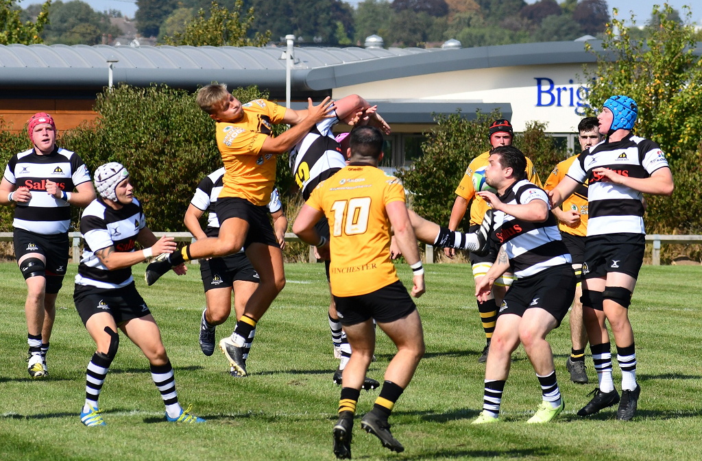 No holds barred as both teams go for the ball at the kick off
