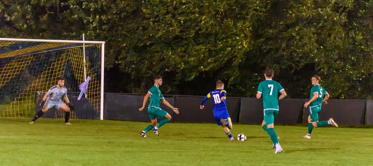 Oli Davies (number ten) opens the scoring for Petersfield Town against Brockenhurst