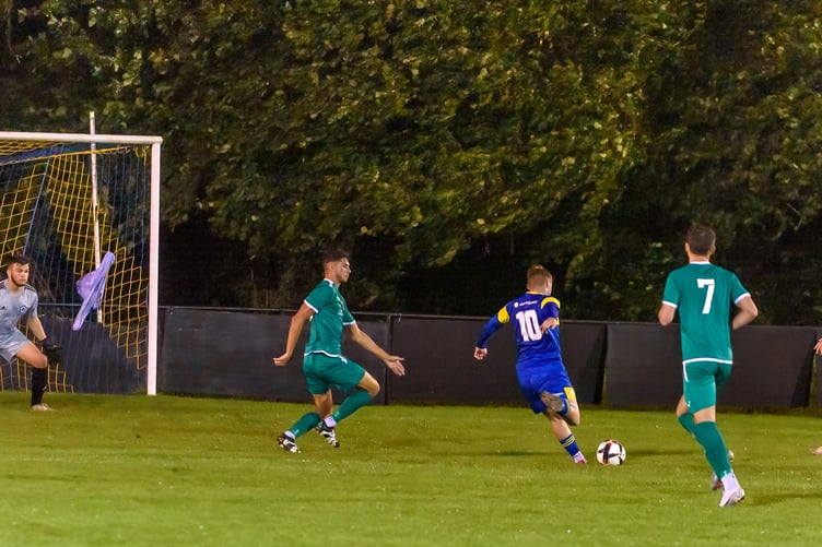 Oli Davies (number ten) opens the scoring for Petersfield Town against Brockenhurst