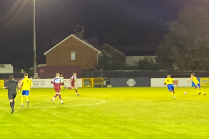 Action from Farnham Town's 6-0 win against Guildford City