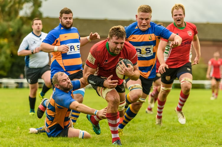 Player-coach Liam Perkins scores