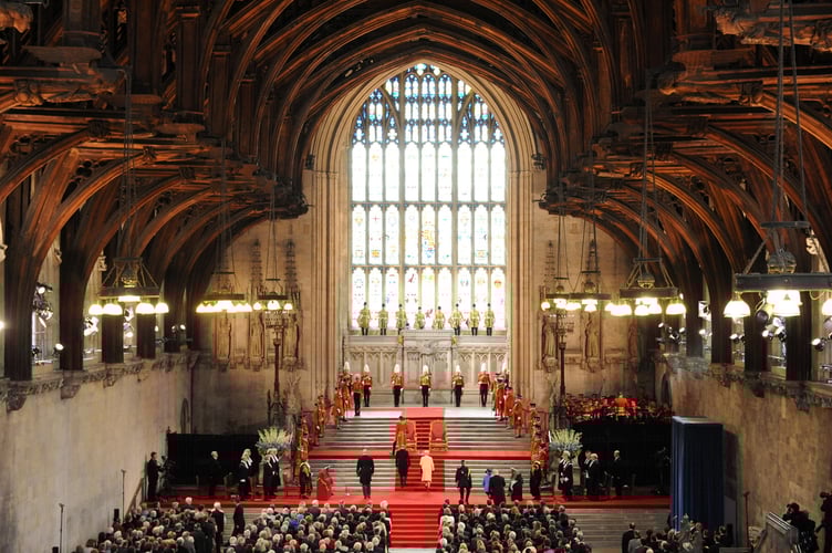 The Queen and Prince Philip, Duke of Edinburgh enter Westminster Hall, the wooden roof beams of which were crafted in Farnham