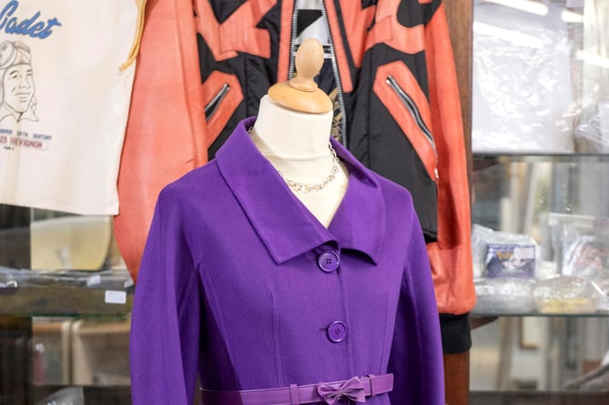 A violet Christian Dior double-faced Italian cashmere coat is expected to fetch £300