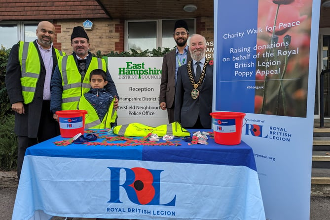 The Ahmadiyya Muslim Elder Association were joined by Cllr Anthony Williams and Cllr Adeel Shah as they launched their fundraising appeal for the Royal British Legion, October 2023.

From left: Luqman Chaudhary, Regional Chair Charity Walk for Peace, AMEA Hampshire and Surrey Areas; Imam Mir Anjum Parvez, Regional President AMEA Hampshire and Surrey Areas; Farhan Chaudhary; Cllr Adeel Shah, Community Development and Engagement Portfolio Holder for EHDC; and Cllr Anthony Williams, Chairman of EHDC.