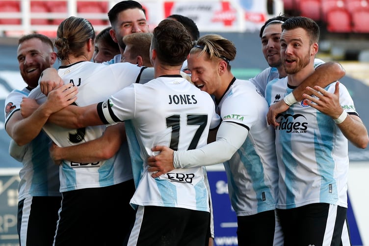 Aldershot Town celebrate one of their seven goals at Swindon Town