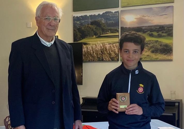 Ollie McDonald receives his prize from Frank Hayward at Hockley Golf Club
