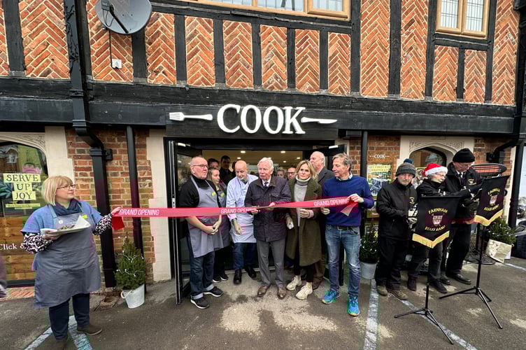 COOK co-founders Ed Perry (right) and Dale Penfold cut the ribbon to open their new East Street shop