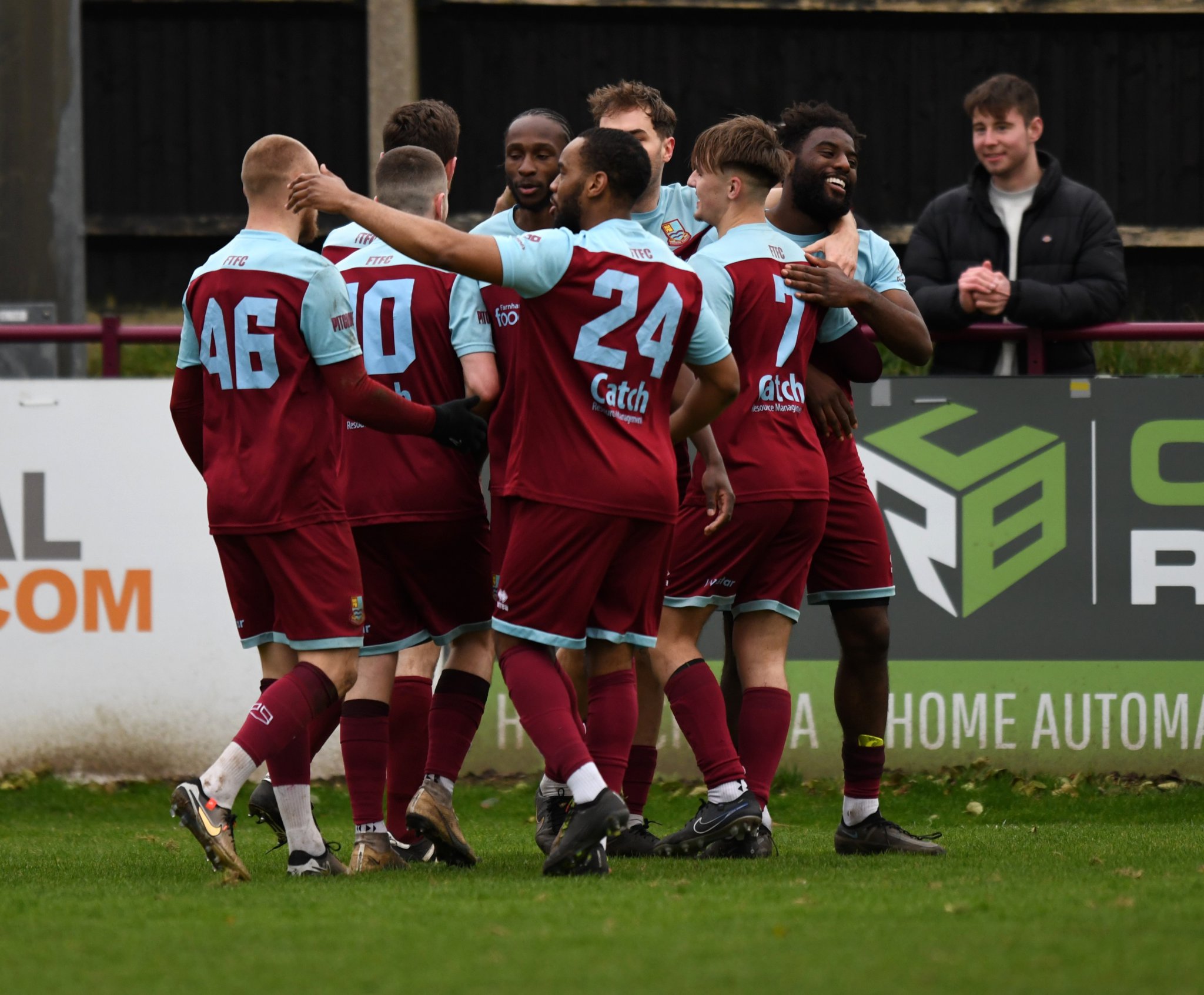 Farnham Town celebrate Lamar Koroma's goal against Camberley Town