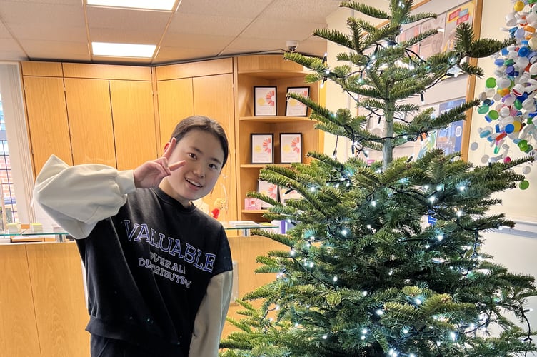The winner of Farnham's Twelve Days of Christmas competition Chris Choi with her hamper