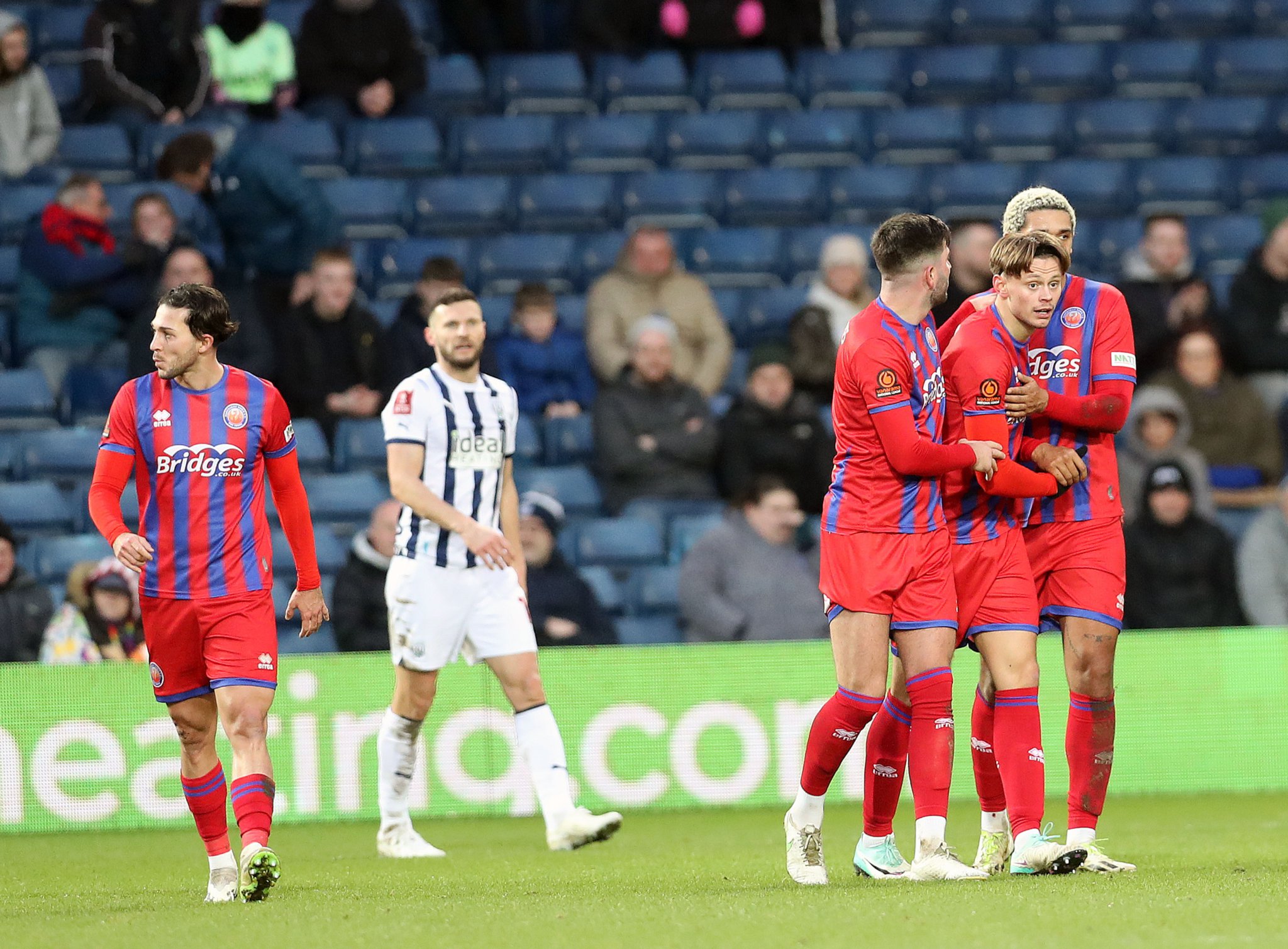 Ollie Bray is congratulated after scoring