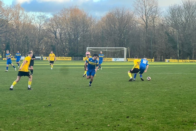Petersfield’s Tommy Tierney on the ball at Hamble