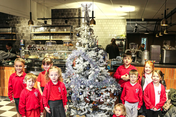 Pupils from Badshot Lea Village Infant School with the finished tree