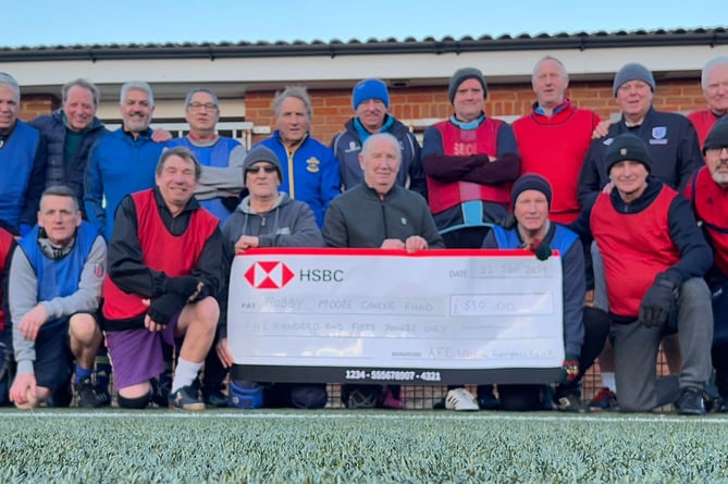 Alton FC walking footballers with cheque for £550 for Bobby Moore Fund, December 2023.