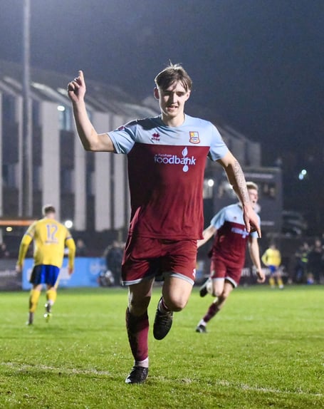 Owen Dean celebrates after scoring Farnham Town's second goal against Redhill