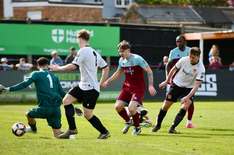Owen Dean scores Farnham Town's second goal against Balham