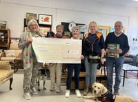 Furniture shop donates £1,000 to assistance dogs charity