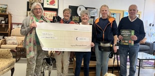 Furniture shop donates £1,000 to assistance dogs charity