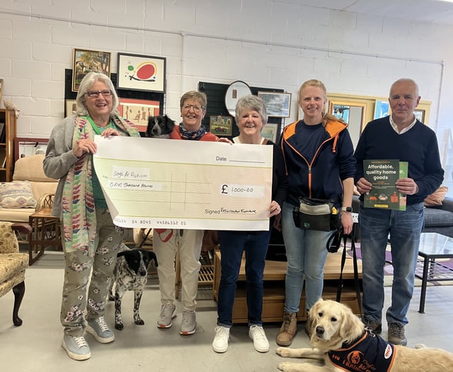 Furniture shop donates £1,000 to assistance dogs charity