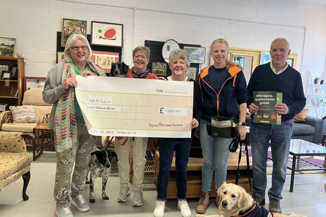 Cheque presentation to Dogs for Autism at Resurrection Furniture, High Street, Alton, April 2024.