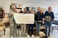 Furniture shop donates £1,000 to assistance dogs charity