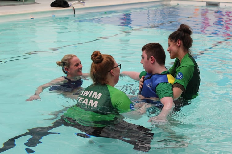 Suzanna Hext helps a student learn to swim at Treloar's, May 2024.