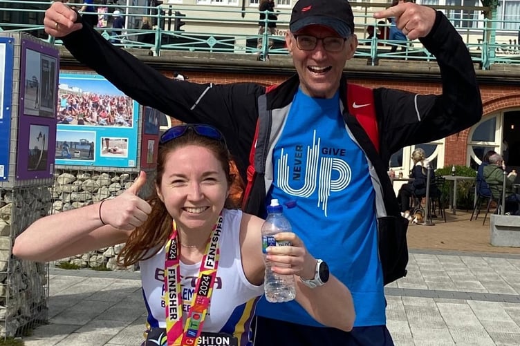 Beth Sutton celebrates her Brighton Marathon success