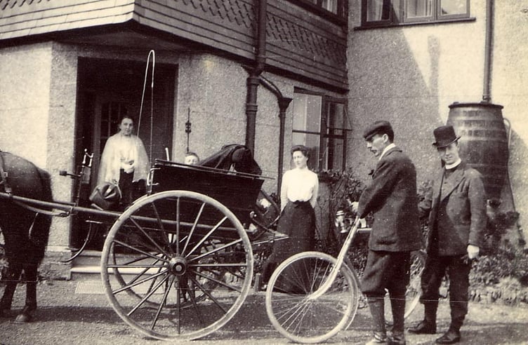 From an album found in attic of Whitehall, Churchstow. People outside house, vicar, bicycle and pony and trap