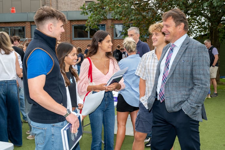 Churcher's students talking to Headmaster Simon Williams