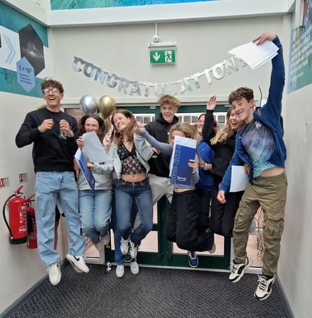 Students celebrate the results of their hard work
