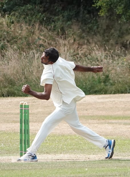 Clanfield bowler Jugal Kinsore in action