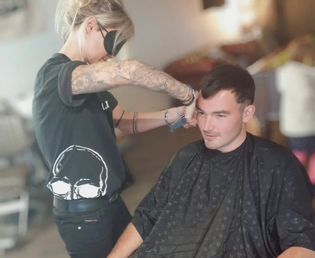 Blindfolded barbers cut hair for mental health charity
