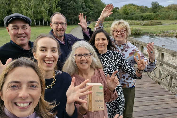 Sue Edberg (centre) on behalf of Petersfield Community Garden with representatives from the Tree Council and Network Rail celebrating the award win