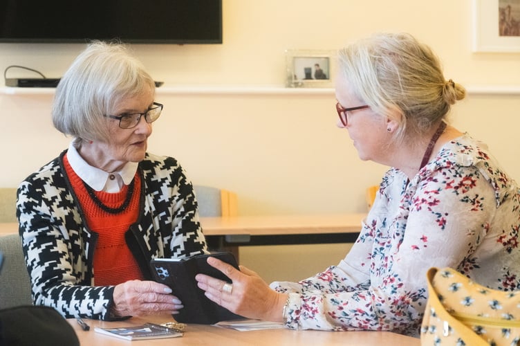 Alresford resident Iris talks to community engagement officer Davina at the digital drop-in session, Makins Court, Alresford, November 1st 2024.