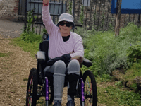 Stroke survivor Sally Stoodley does 66-mile trek in wheelchair 